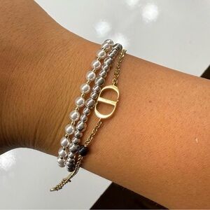 Gold Link Christian Dior CD bracelet with black charm. Women Jewelry